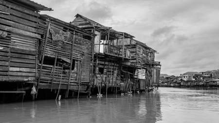 Wooden house on Karang Mumus Riverbank. Slum area on Karang Mumus river, Samarinda, Indonesiaのeditorial素材