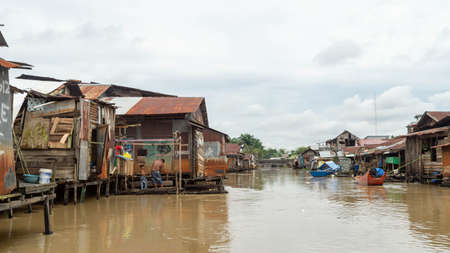 Wooden house on Karang Mumus Riverbank. Slum area on Karang Mumus river, Samarinda, Indonesiaのeditorial素材