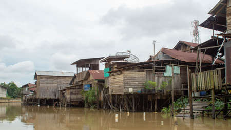 Wooden house on Karang Mumus Riverbank. Slum area on Karang Mumus river, Samarinda, Indonesiaのeditorial素材