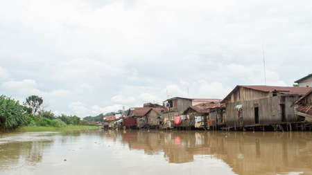 Wooden house on Karang Mumus Riverbank. Slum area on Karang Mumus river, Samarinda, Indonesiaのeditorial素材