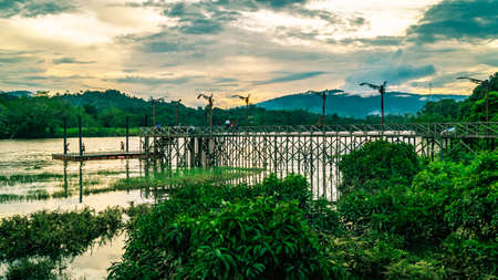 people swimming at Mahakam river at sunsetの写真素材
