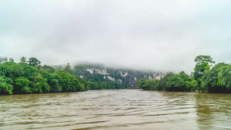 Batu Dinding, iconic landscape of limestone wall on the upper Mahakam riverbank. Beautiful landscape of karst on the riverbankの写真素材