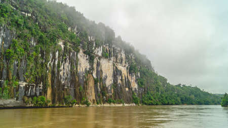 Batu Dinding, iconic landscape of limestone wall on the upper Mahakam riverbank. Beautiful landscape of karst on the riverbankの写真素材