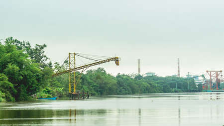 Huge conveyor at Mahakam Riverbank used to load coal to the barge. Industrial and mining backgroundの写真素材