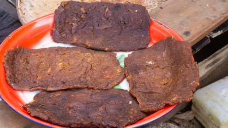 Lempok or dodol durian, traditional sweet dish from Indonesia, made from durian, coconut milk, palm sugar, and rice flour, dried under the sun.の写真素材