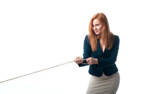 beautiful woman pulls the ropeの写真素材