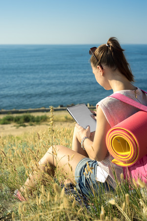 the traveler keeps a diary in the hikeの写真素材