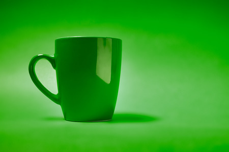cup of coffee on a green backgroundの写真素材