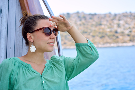 young woman riding on a yacht in Turkeyの写真素材