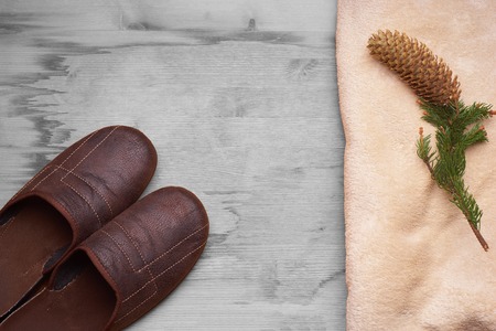 slippers on a wooden floor next to the knobの写真素材