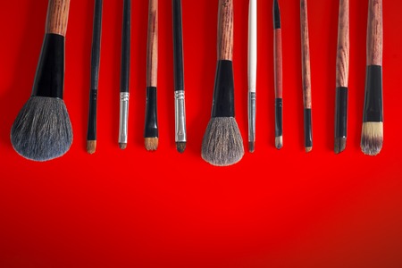 makeup brush and cosmetics, on a color backgroundの写真素材