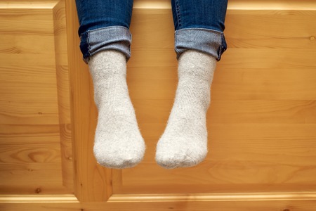 female legs in woolen socksの写真素材