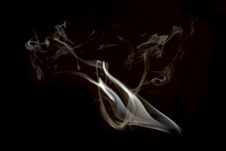 a cloud of cigarette smoke on a white backgroundの写真素材