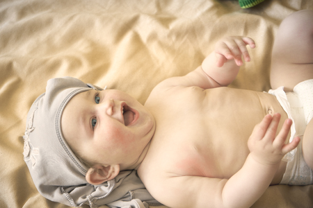 Happy baby lying on his stomach