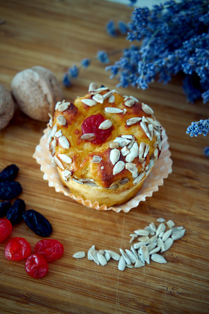 Delicious cupcake lie on a wooden tableの写真素材