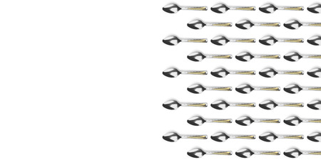 Many spoons lie on an isolated background