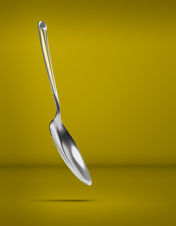 The spoon lies on an isolated background - cutlery 3D render - 3D imageの写真素材