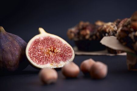 Ripe figs lies near diet muffinsの写真素材