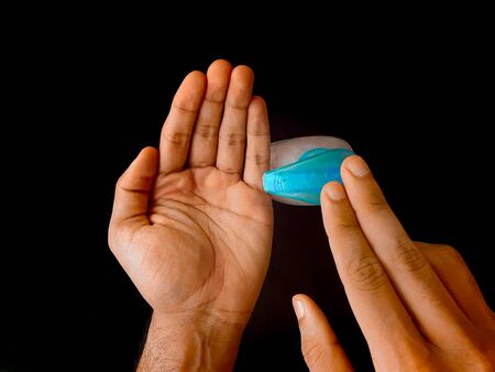 Showing using hand wash to disinfect hands as a prevention of corona virus- COVID19