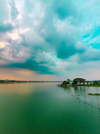 River of Bangladesh during the rainy season with clouds on the skyの写真素材