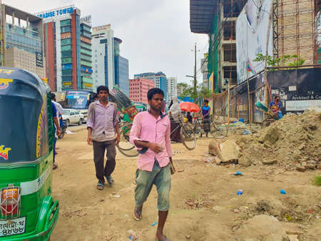 Dhaka,Bangladesh-July 13,2020:Rickshaw puller pulling rickshaw to earn daily living during corona...