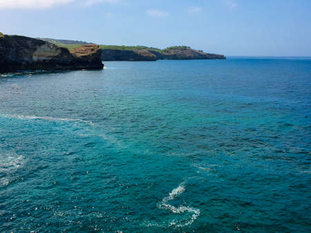 Beautiful view of the Bali Sea from the cliff of a hill in Nus Penida Island in Bali, Indonesia....