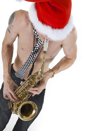 Young Santa playing on saxophoneの写真素材