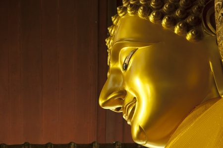 close up face of buddha statue in thailand templeの写真素材