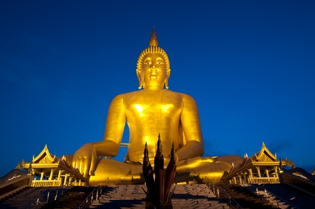 Very big Buddha Statue and Twilight time in Thailandの写真素材