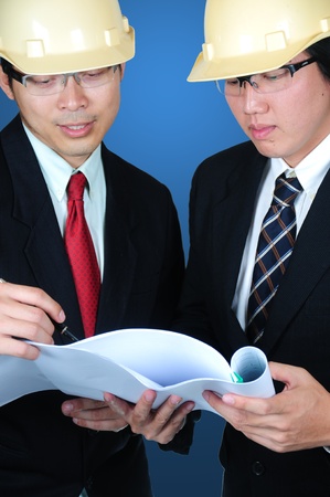 Engineer Manager discussing concept with production line for control cost and make up profitの写真素材