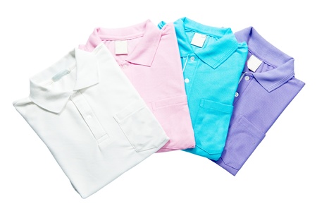 Stack colorful Polo - shirts freshly folded from the laundry isolated on the white backgroundの写真素材