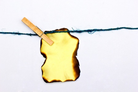 Hold Burn Paper with wood clip with white background