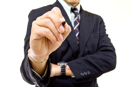 Businessman writing growing graph in studioの写真素材