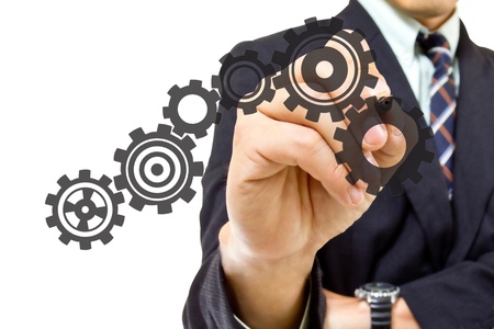 Businessman writing Gear group in studioの写真素材