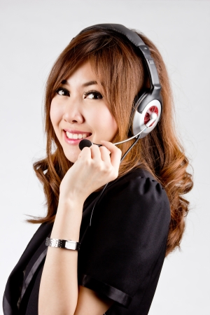 Asian women call center with phone headset with white backgroundの写真素材