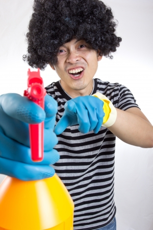 portrait spay man for cleanning something in studioの写真素材