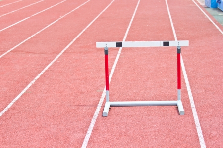 hurdles on the red running track prepared for competition.の写真素材