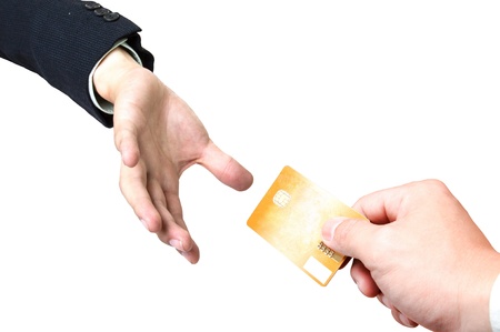 Close up Payment machine on during using Credit card from customer with white backgroundの写真素材