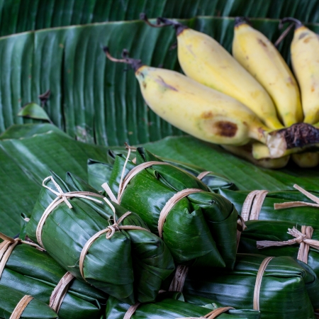 Bunch of mush ,Thai dessert style which insert banana inside to glutinous riceの写真素材