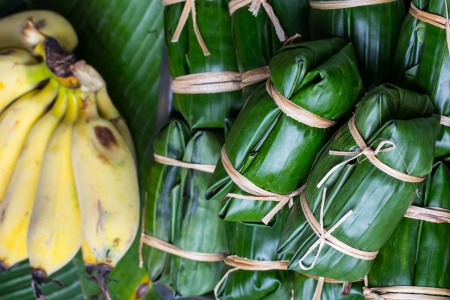 Bunch of mush ,Thai dessert style which insert banana inside to glutinous riceの写真素材
