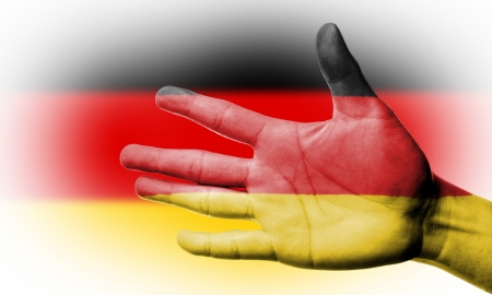 Cheering fan with Painting  national German flag with your hand with your hand for cheer your national sportの写真素材