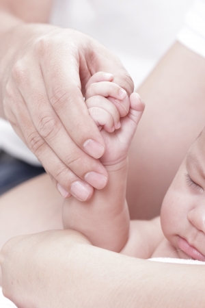 lovely baby use hand hold Dad Thumbの写真素材
