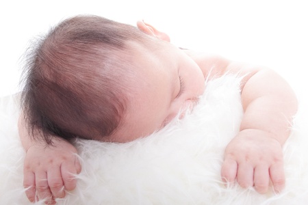 Close Sleeping Asian baby with white backgroundの写真素材