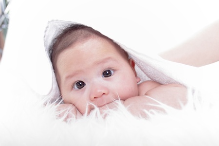 Close up Asian baby girl with white backgroundの写真素材