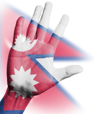 Cheering fan with Painting national Nepal  flag with your hand with your hand for cheer your national sportの写真素材