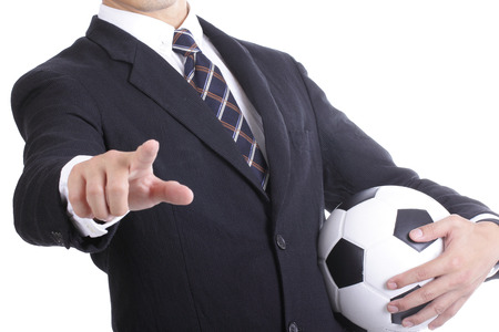 Football manager hold ball for command player for follow as planningの写真素材