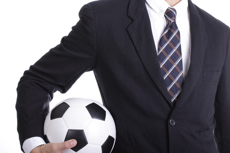 Football manager hold ball for command player for follow as planningの写真素材