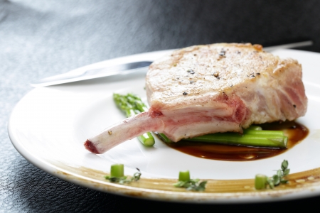 Close up Grilled Pork chop with asparagusの写真素材