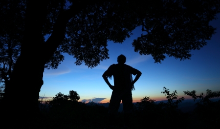 Silhouette people stand and look nature in twilight timeの写真素材