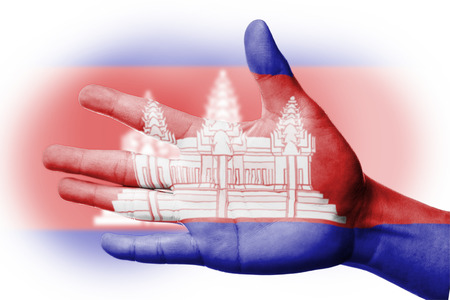 Cheering fan with Painting national Cambodia flag with your hand with your hand for cheer your national sportの写真素材